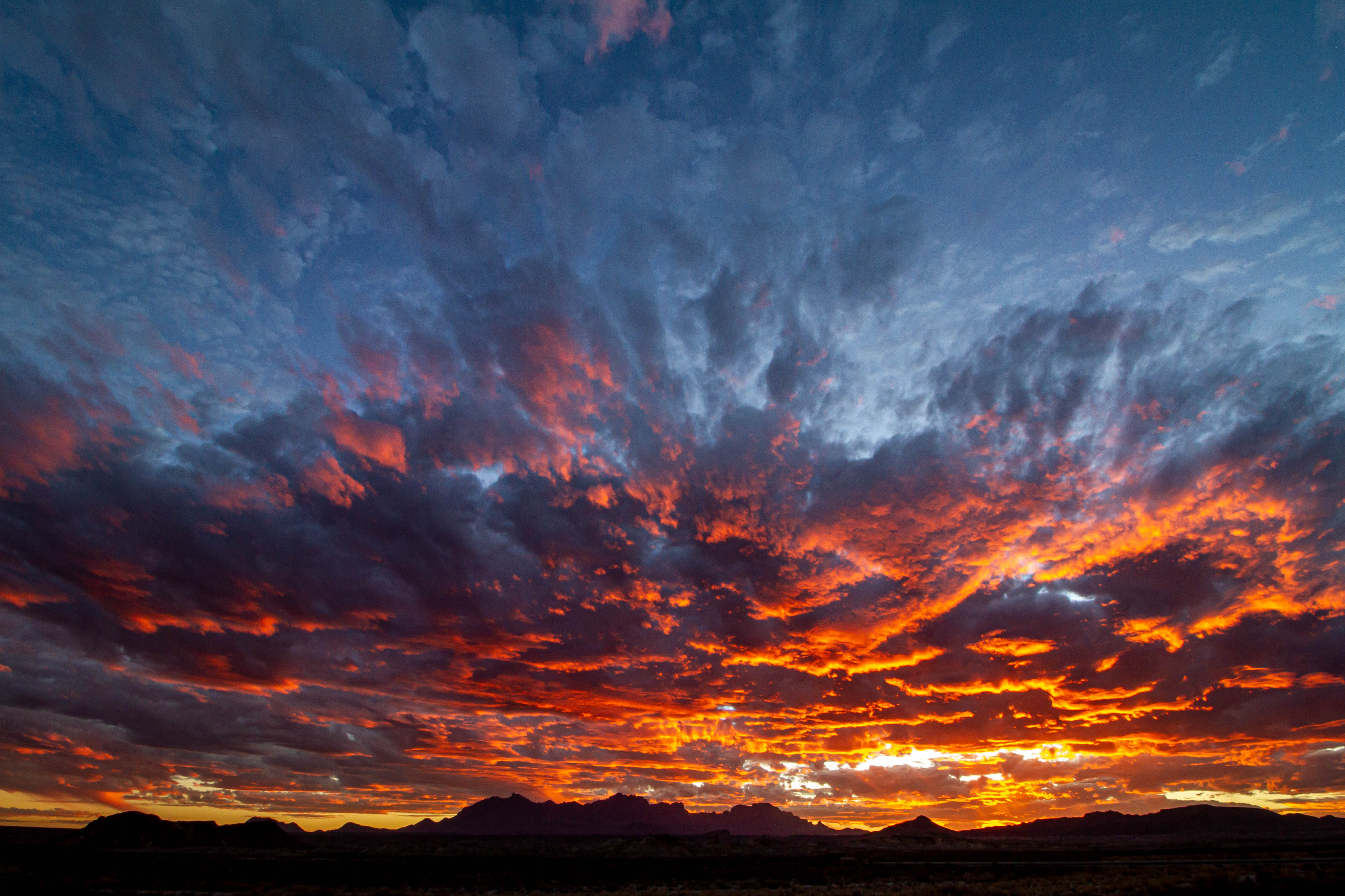 Chisos Mountains sit under an orange sunset